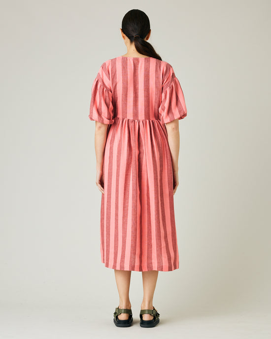 pregnant model wears blush stripe linen winnie dress