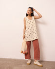 model wears reeta bone spot linen dress