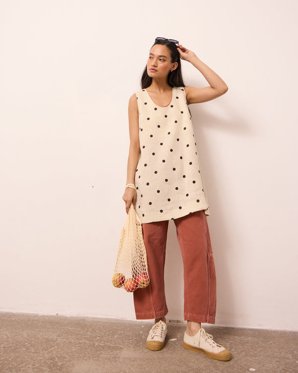 model wears reeta bone spot linen dress
