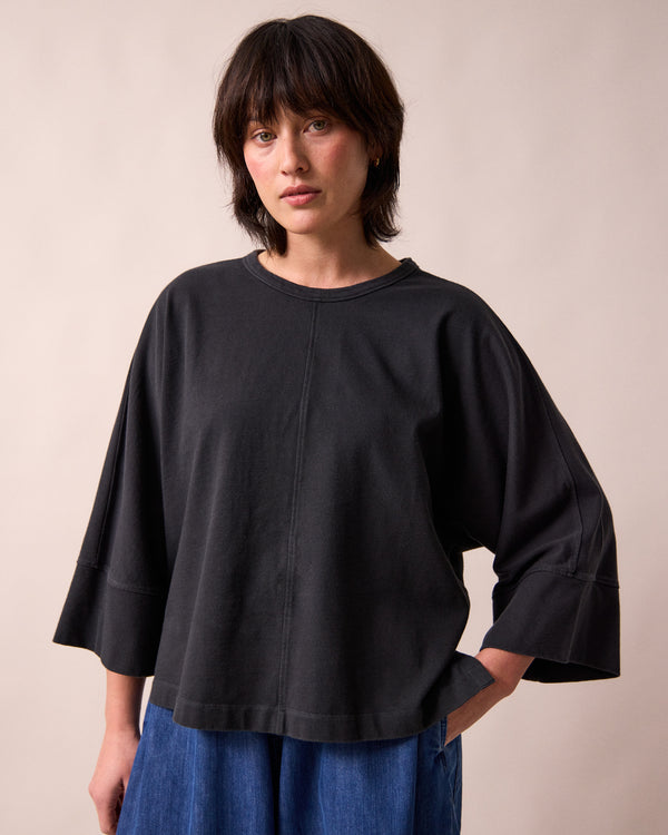 model wears yuna black jersey top