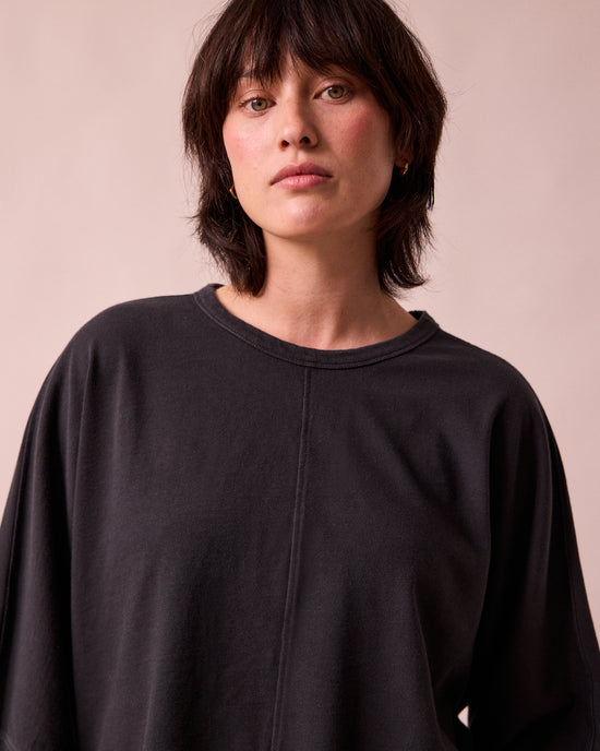 model wears yuna black jersey top