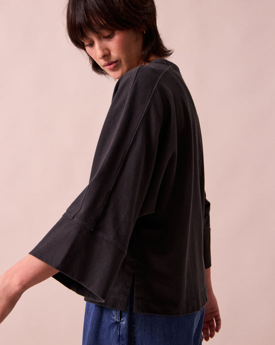 model wears yuna black jersey top