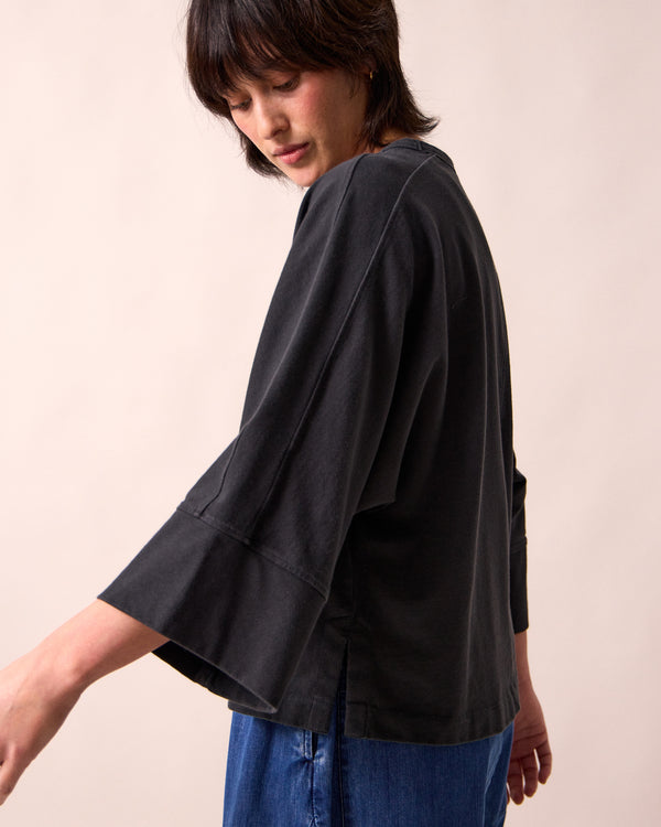 model wears yuna black jersey top