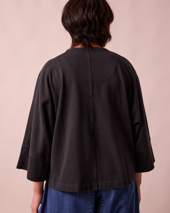 model wears yuna black jersey top