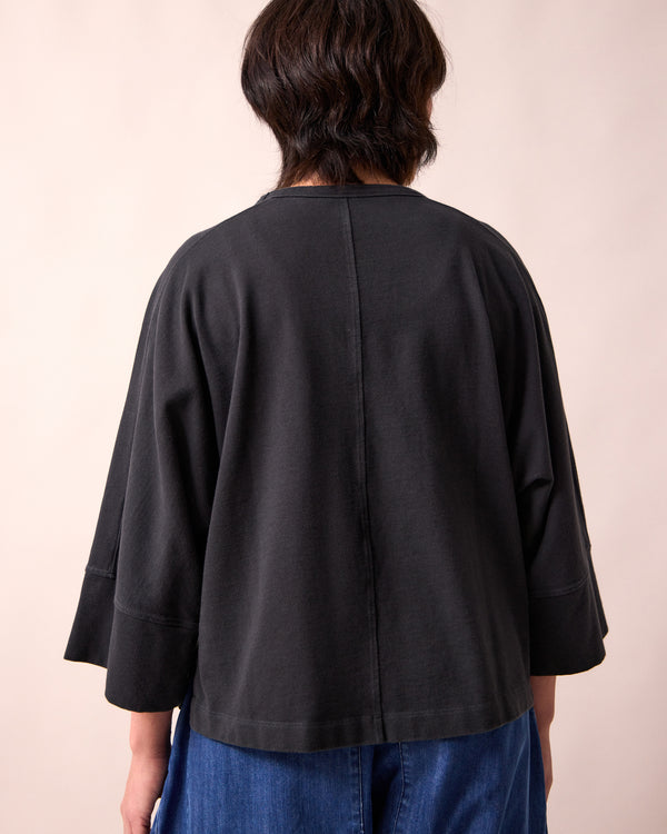 model wears yuna black jersey top