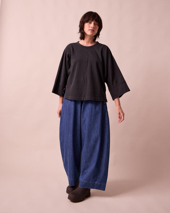 model wears yuna black jersey top