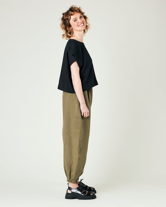 model wears light khaki linen yoli trousers