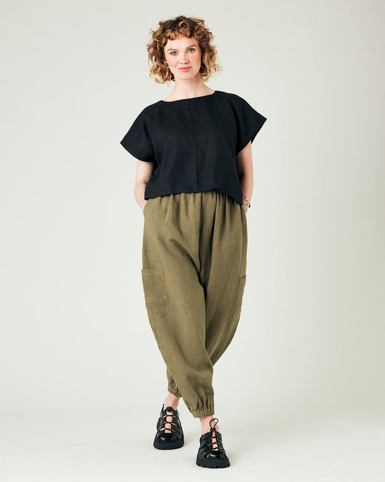 model wears light khaki linen yoli trousers