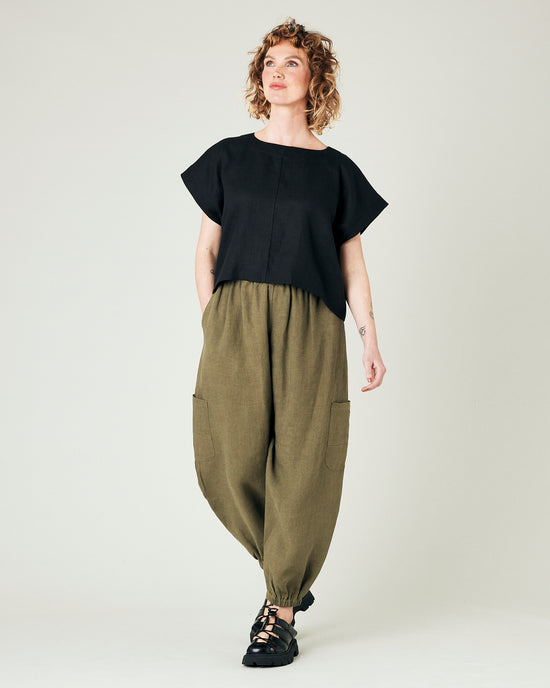 model wears light khaki linen yoli trousers