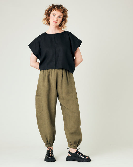 model wears light khaki linen yoli trousers