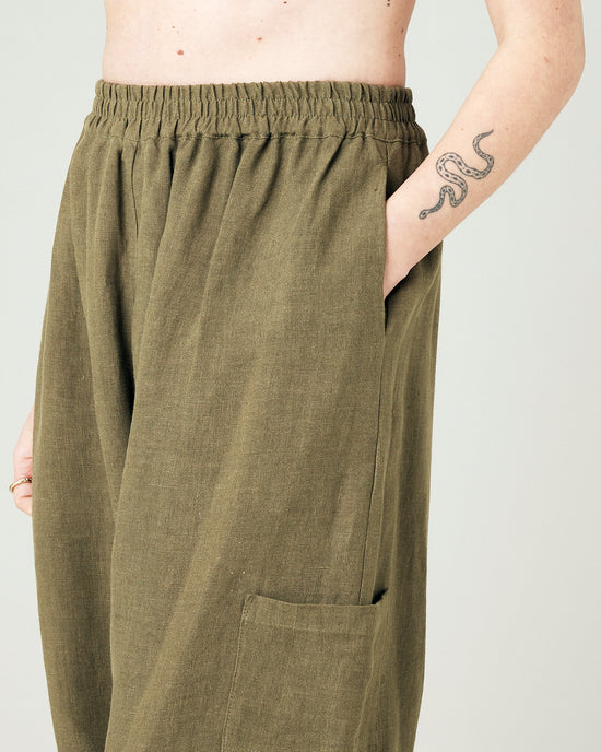 model wears light khaki linen yoli trousers