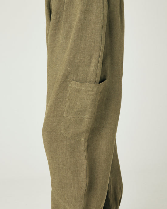 model wears light khaki linen yoli trousers