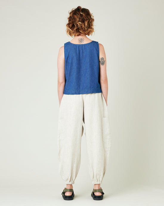 model wears natural linen yoli trousers