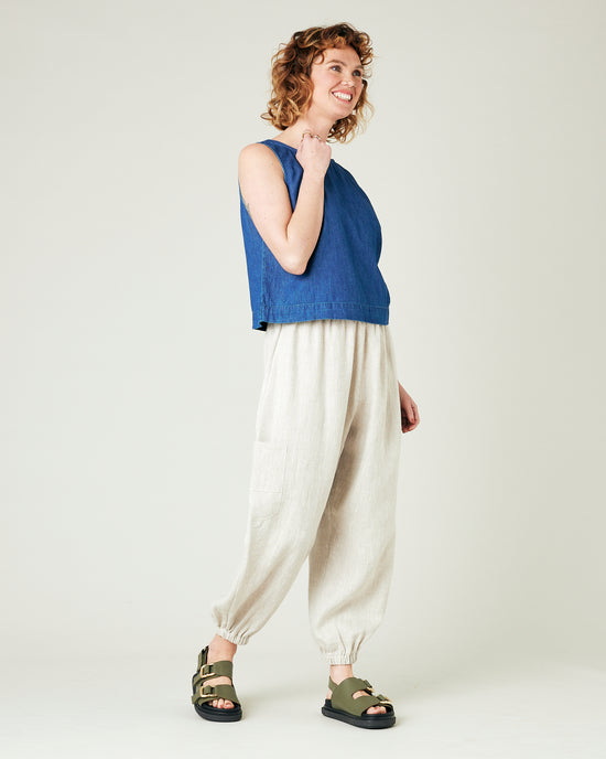 model wears natural linen yoli trousers