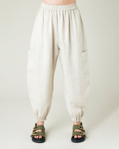 model wears natural linen yoli trousers front