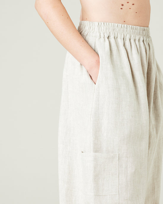 model wears natural linen yoli trousers