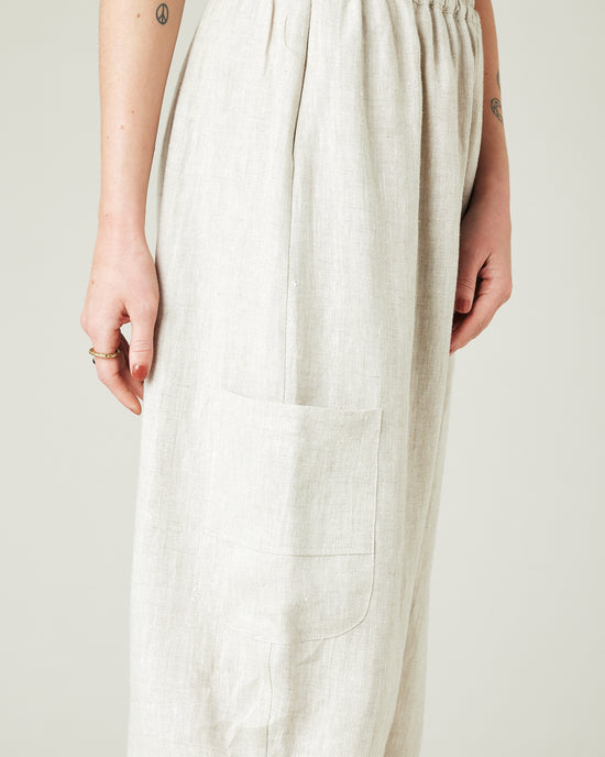 model wears natural linen yoli trousers