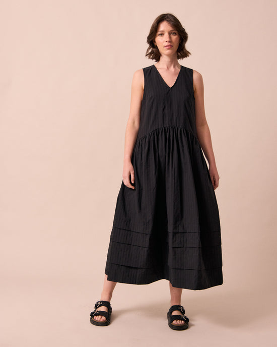 model wears zena black self stripe cotton dress