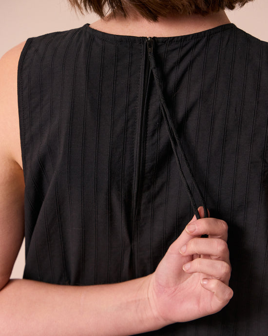 model wears zena black self stripe cotton dress