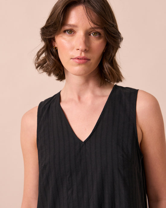 model wears zena black self stripe cotton dress