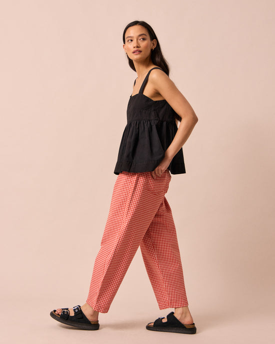 model wears zuri black cotton poplin top
