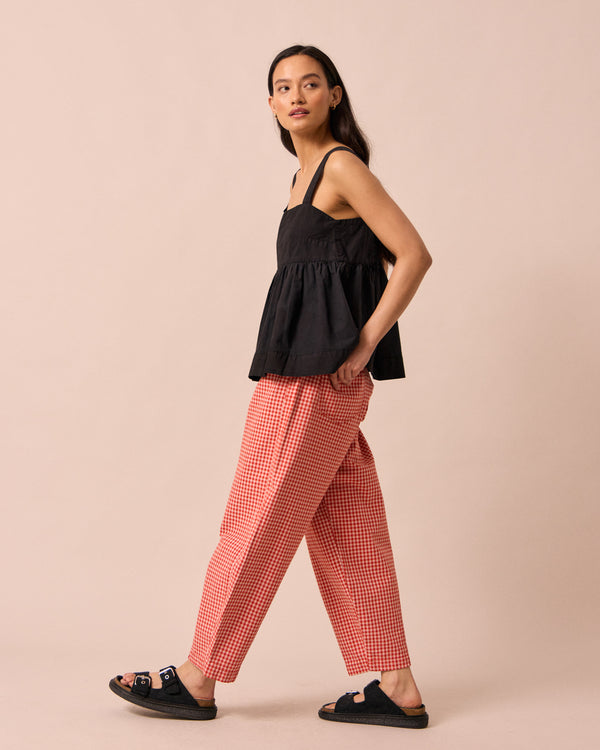 model wears zuri black cotton poplin top