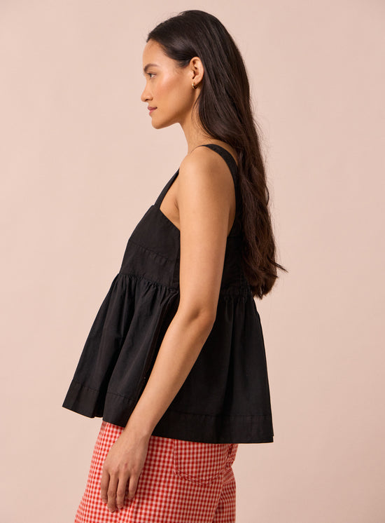 model wears zuri black cotton poplin top
