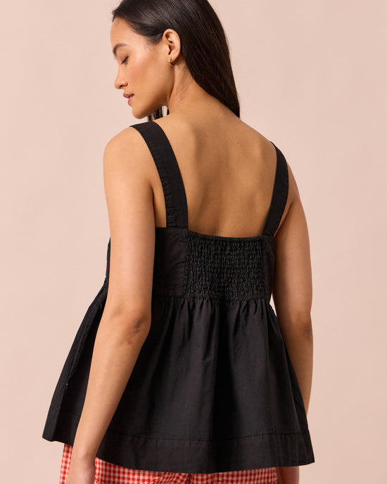 model wears zuri black cotton poplin top
