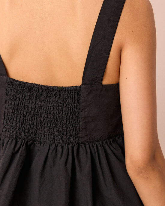 model wears zuri black cotton poplin top