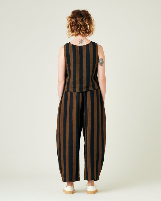 model wears rust stripe linen mabel trousers