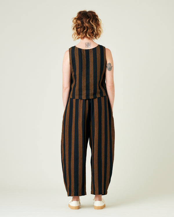 model wears rust stripe linen mabel trousers