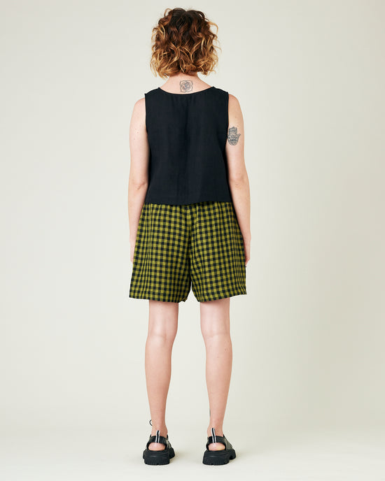 model wears green gingham ari shorts