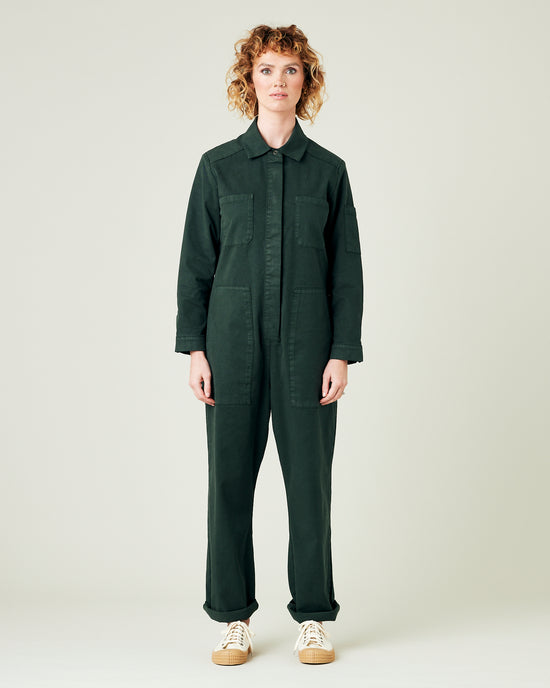 model wears bottle green coverall