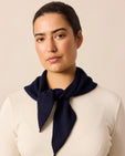 model wears navy knitted neckerchief