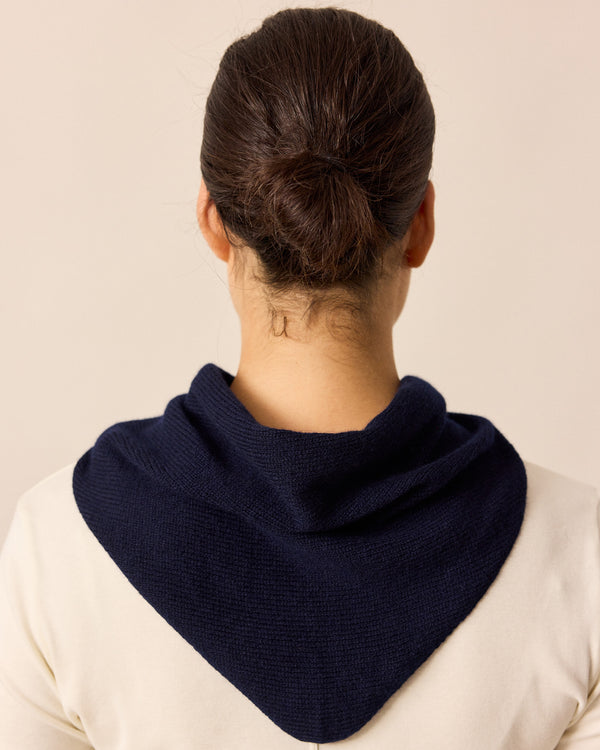 model wears navy knitted neckerchief