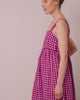model wears suki summer berry gingham linen dress