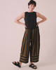 model wears bobbi rust stripe linen trousers