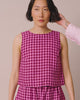 model wears esme summer berry gingham top