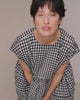 model wears ella black and white gingham seersucker dress