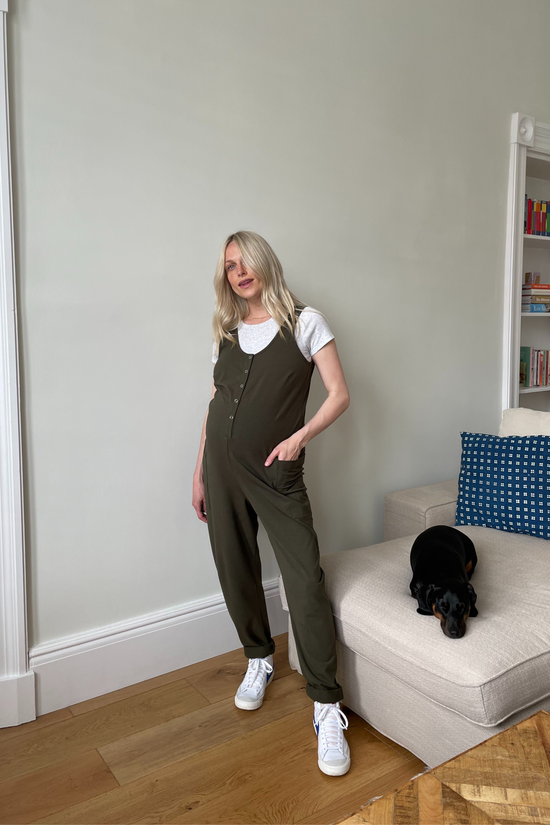 pregnant model wears olive jersey poppy jumpsuit