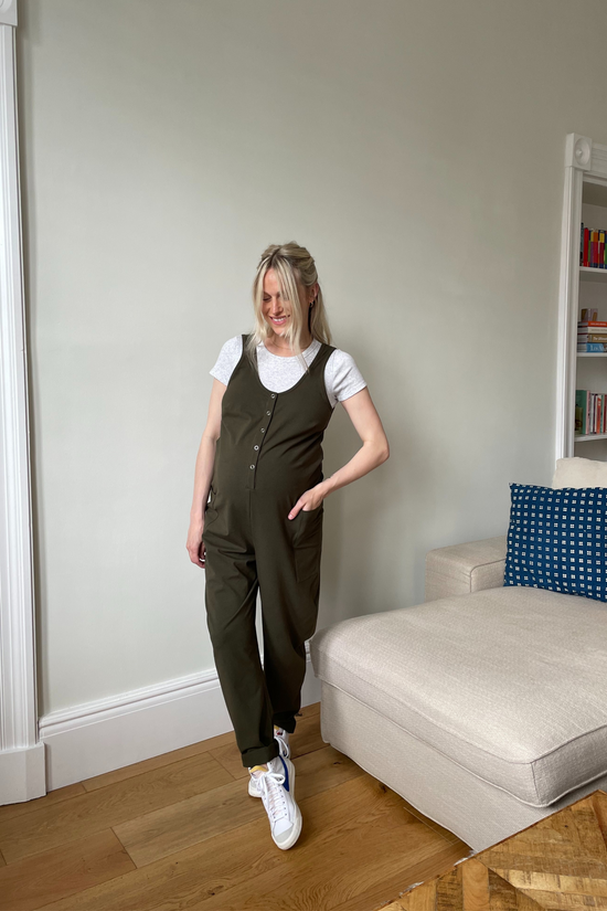 pregnant model wears olive jersey poppy jumpsuit