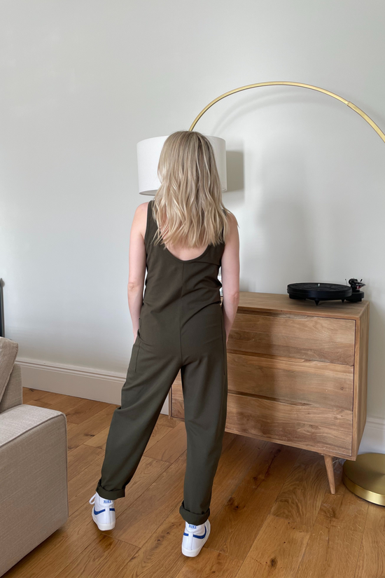 pregnant model wears olive jersey poppy jumpsuit