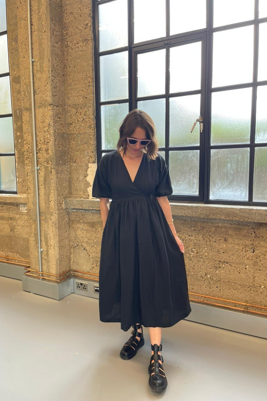 model wears black linen winnie dress