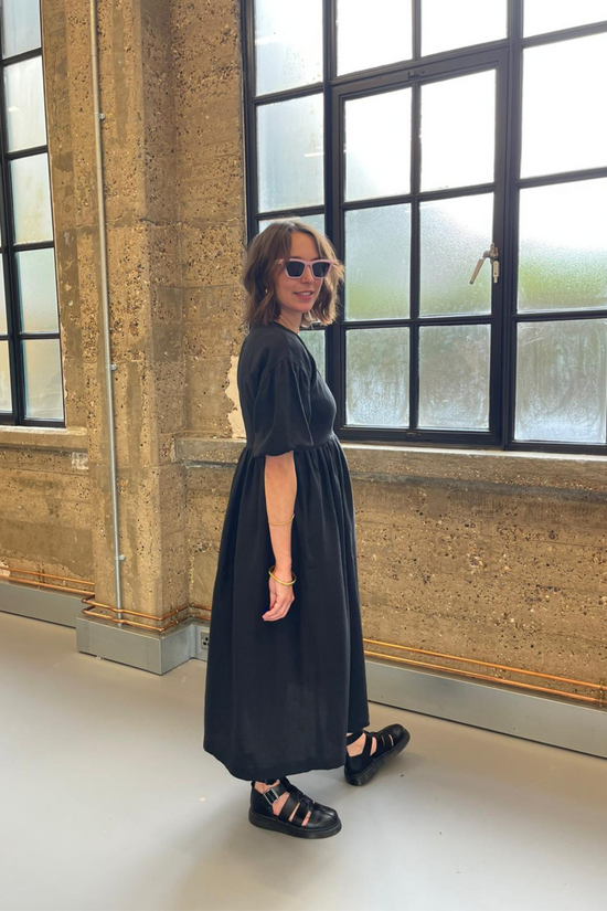 model wears black linen winnie dress