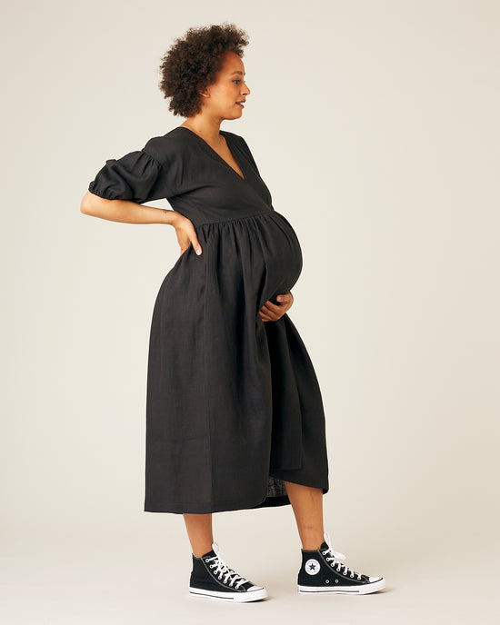 pregnant model wears black linen winnie dress