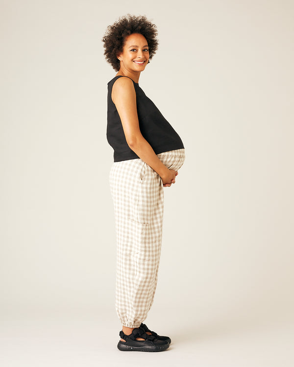 pregnant model wears black linen esme top