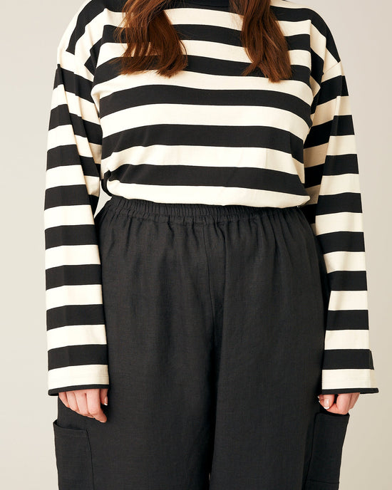 model wears black linen yoli trousers