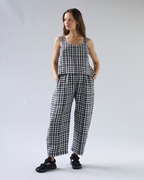 pregnant model wears mono check linen nora top