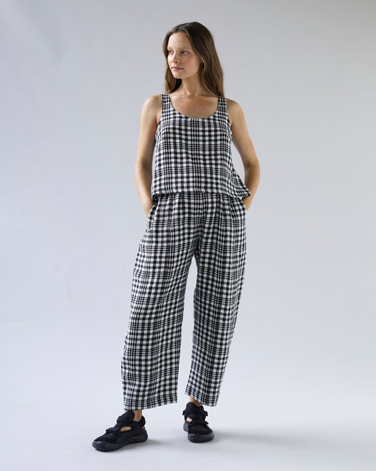 pregnant model wears mono check linen nora top