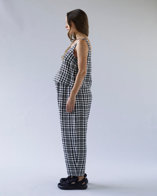 pregnant model wears mono check linen nora top